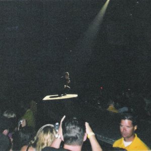 Bono kneeling spotlight